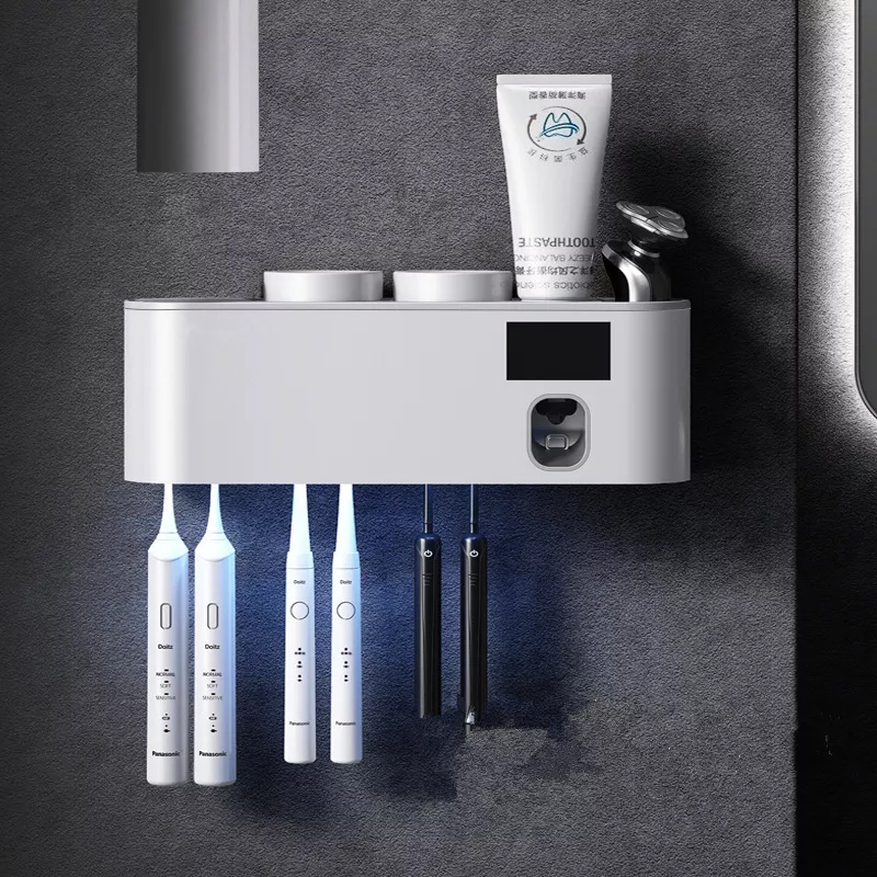 bathroom accessory set toothpaste squeezer dispenser wall mounted tooth paste dispenser with uv toothbrush holder